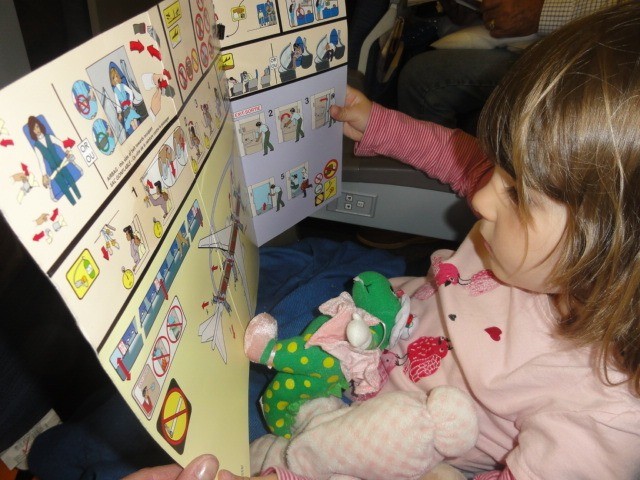 my daughter reading the safety card
